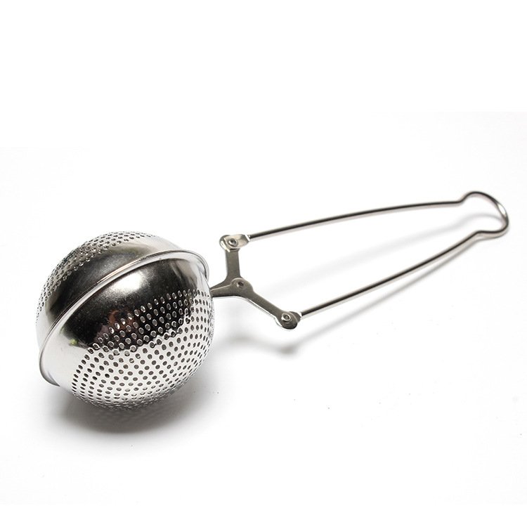 The My Store Easy Grip & Steep Infuser is a stainless steel tea infuser featuring a perforated spherical compartment and a long handle. The handle includes an easy grip clasp mechanism for opening and closing the two halves of the spherical compartment. This dishwasher-safe tea strainer is designed to steep loose tea leaves in hot water.